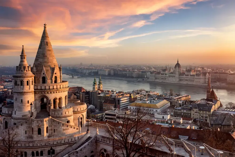 Panoramic Budapest sunset view with Fisherman's Bastion and Parliament