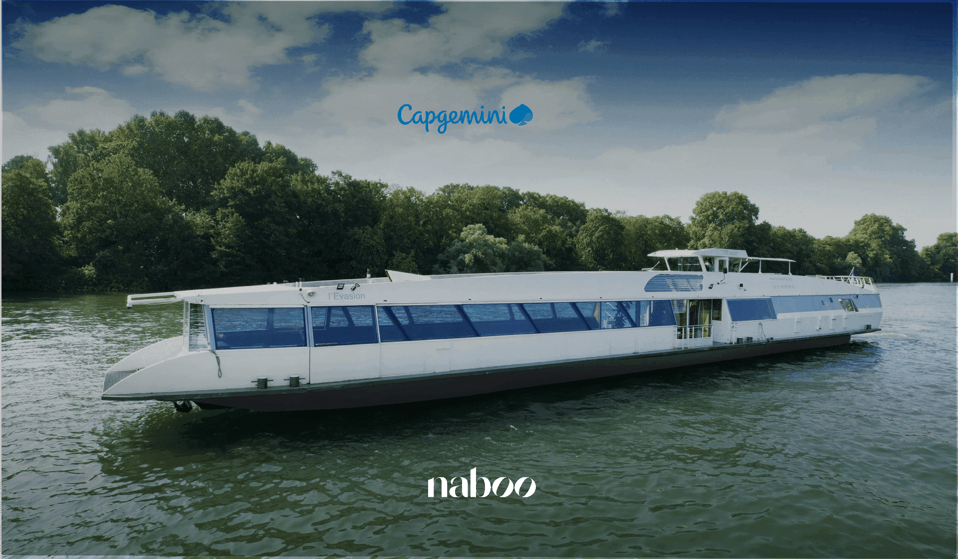 A white riverboat named 'L'Evasion' with large windows cruises on green water past lush trees under a blue