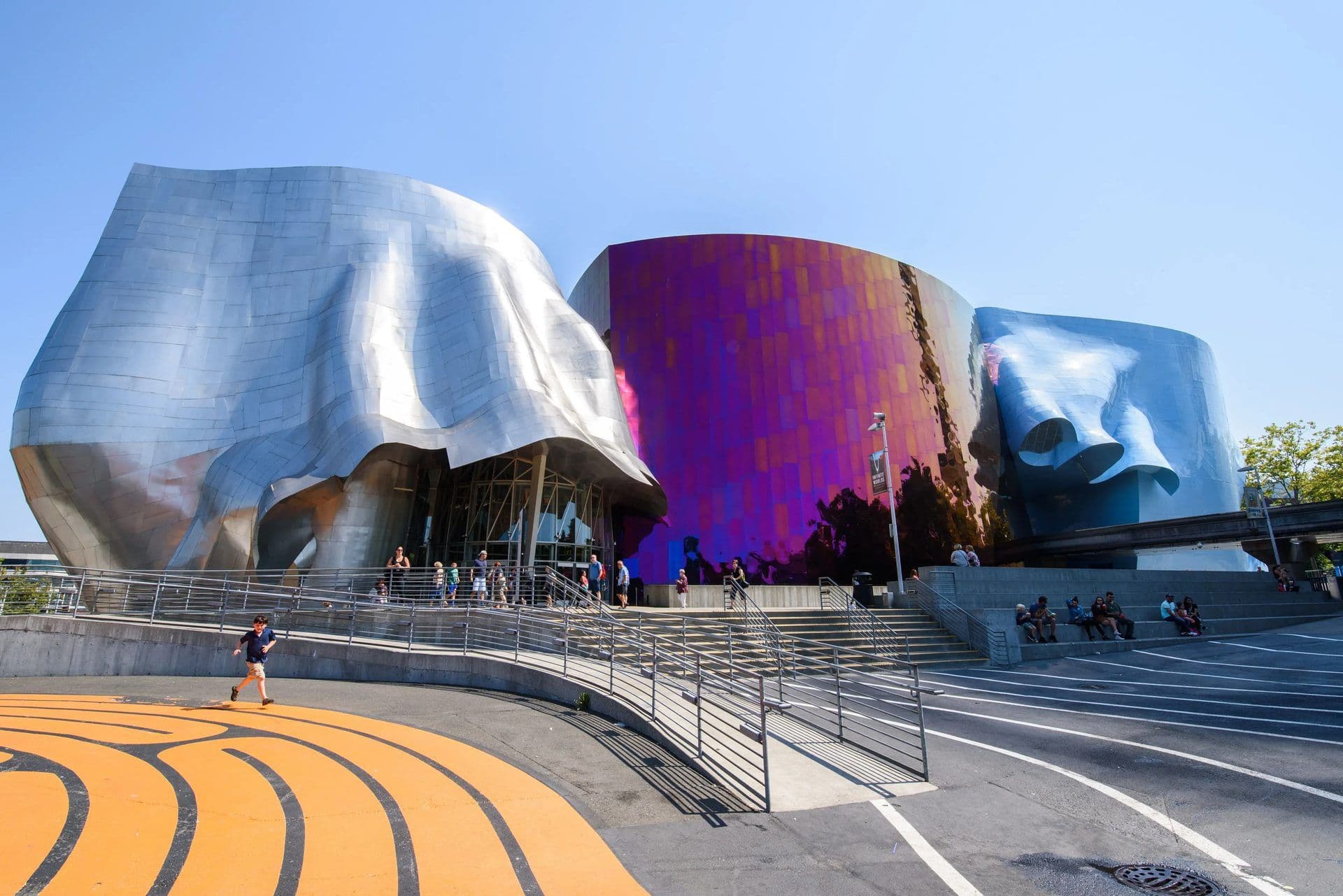 Exterior view of the Museum of Pop Culture in Seattle with its wavy metallic architecture.