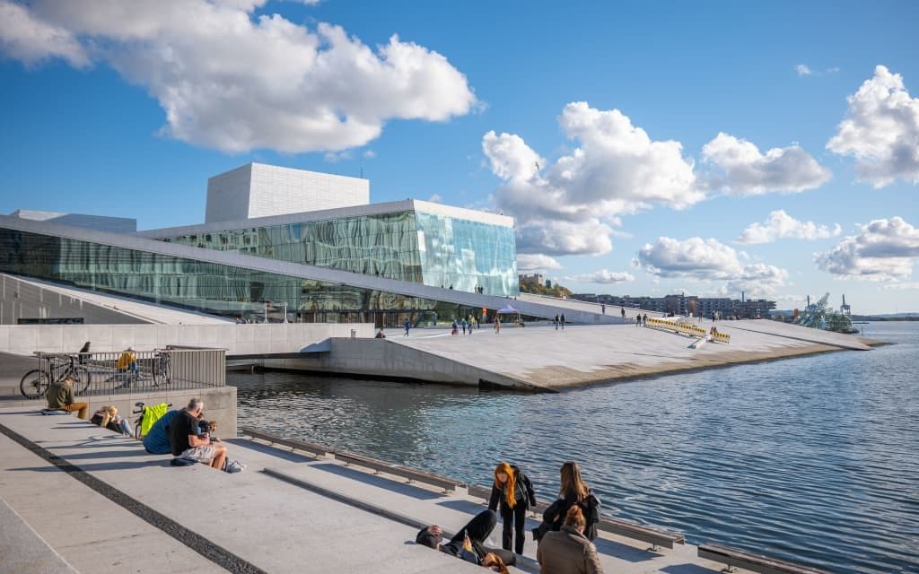 The modern Oslo Opera House, a waterfront corporate event venue with sloping white and glass architecture.