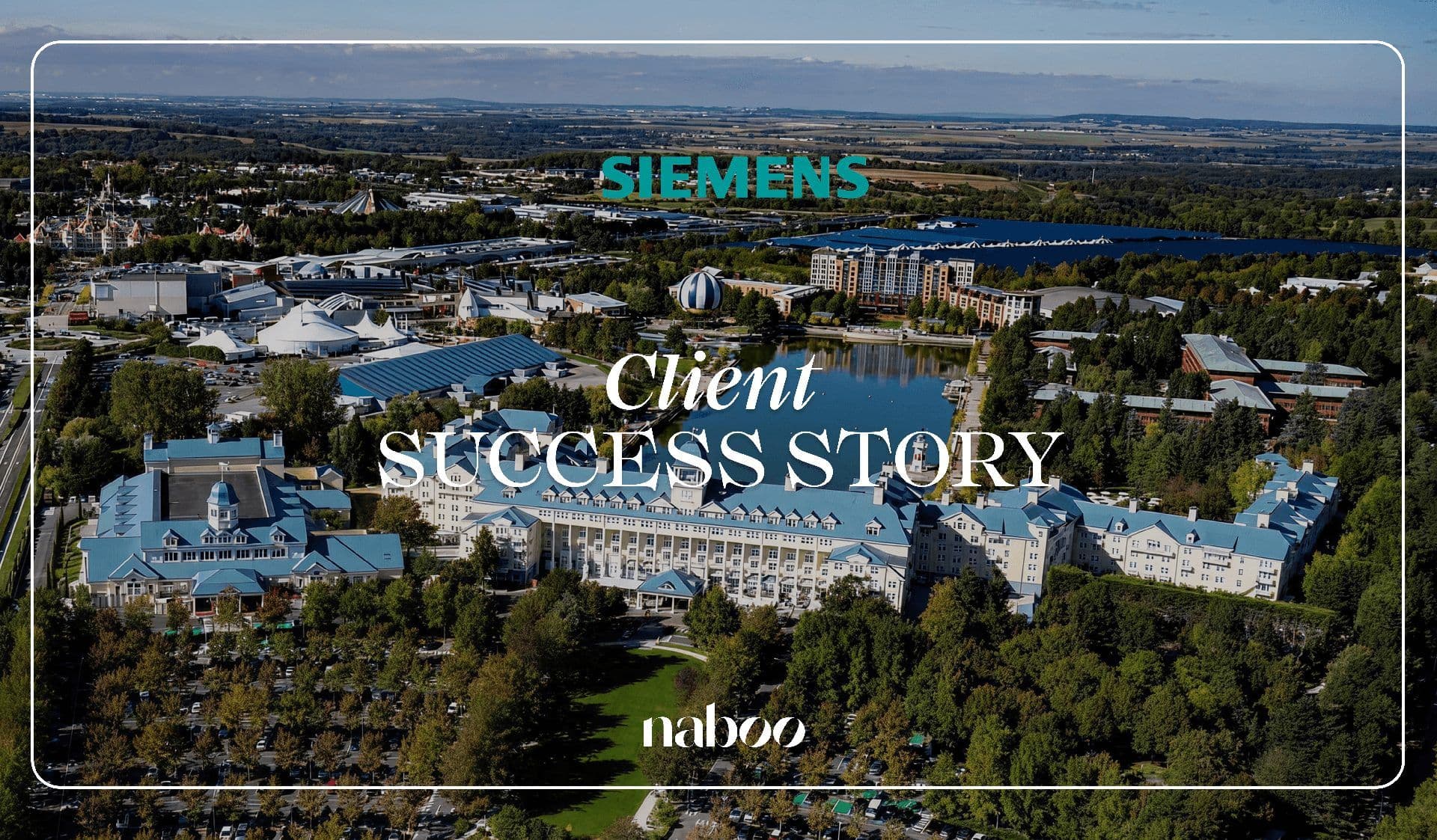 Aerial view of a large waterfront corporate event venue with blue roofs and a lake