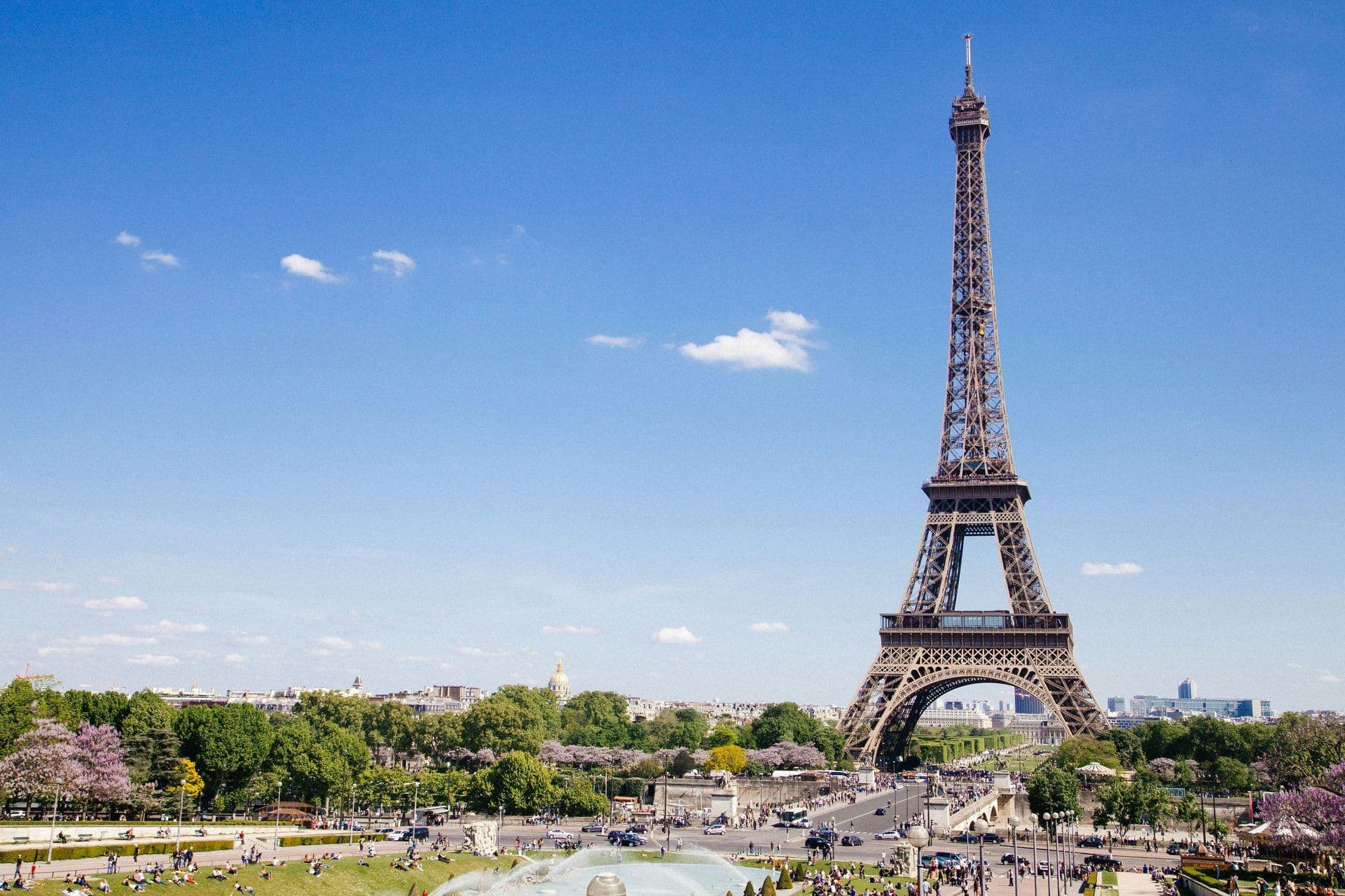 Panoramic view of the Eiffel Tower and Champ de Mars in Paris, a popular outdoor event space.