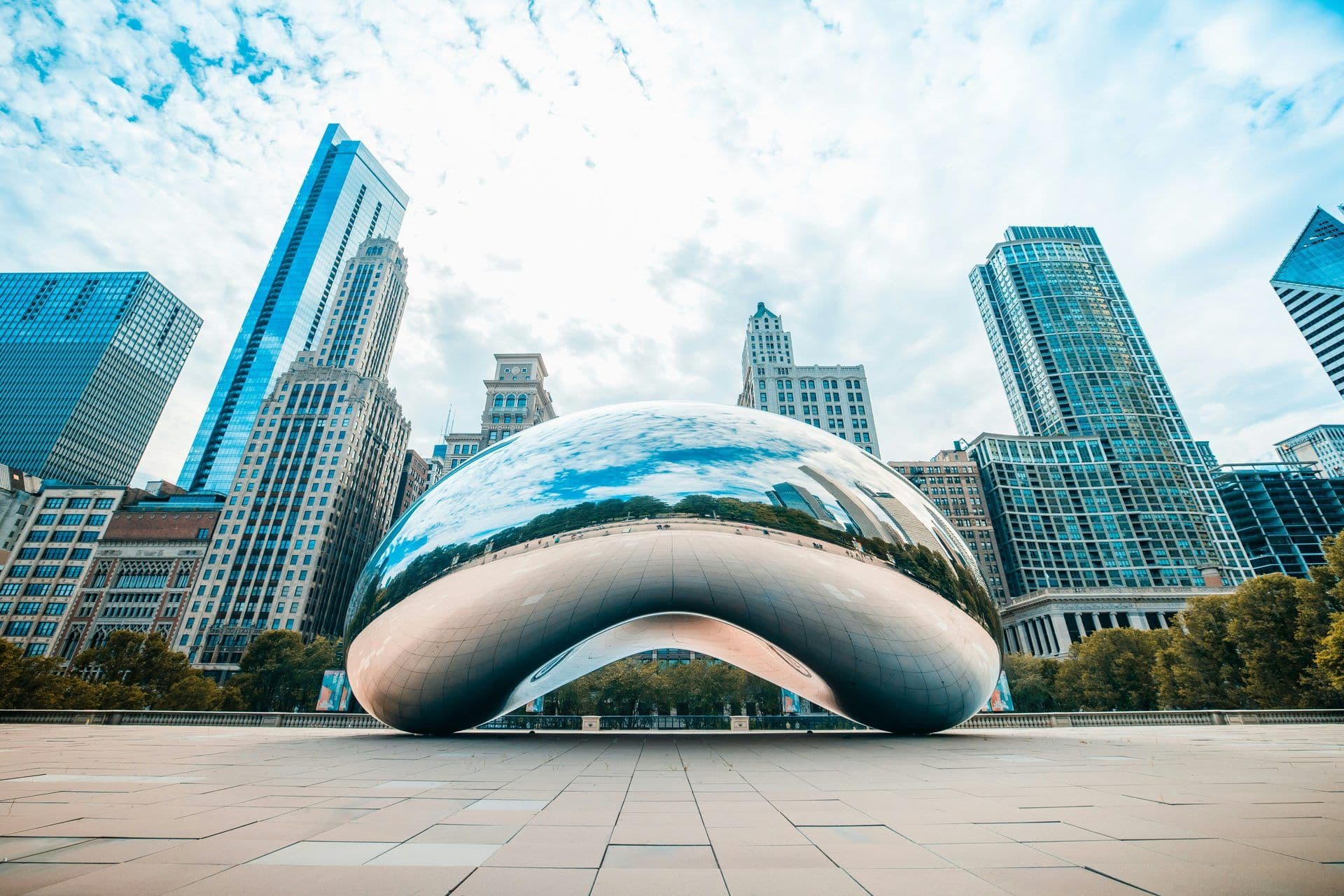 The iconic Cloud Gate sculpture, also known as The Bean, reflects Chicago's skyline and sky.
