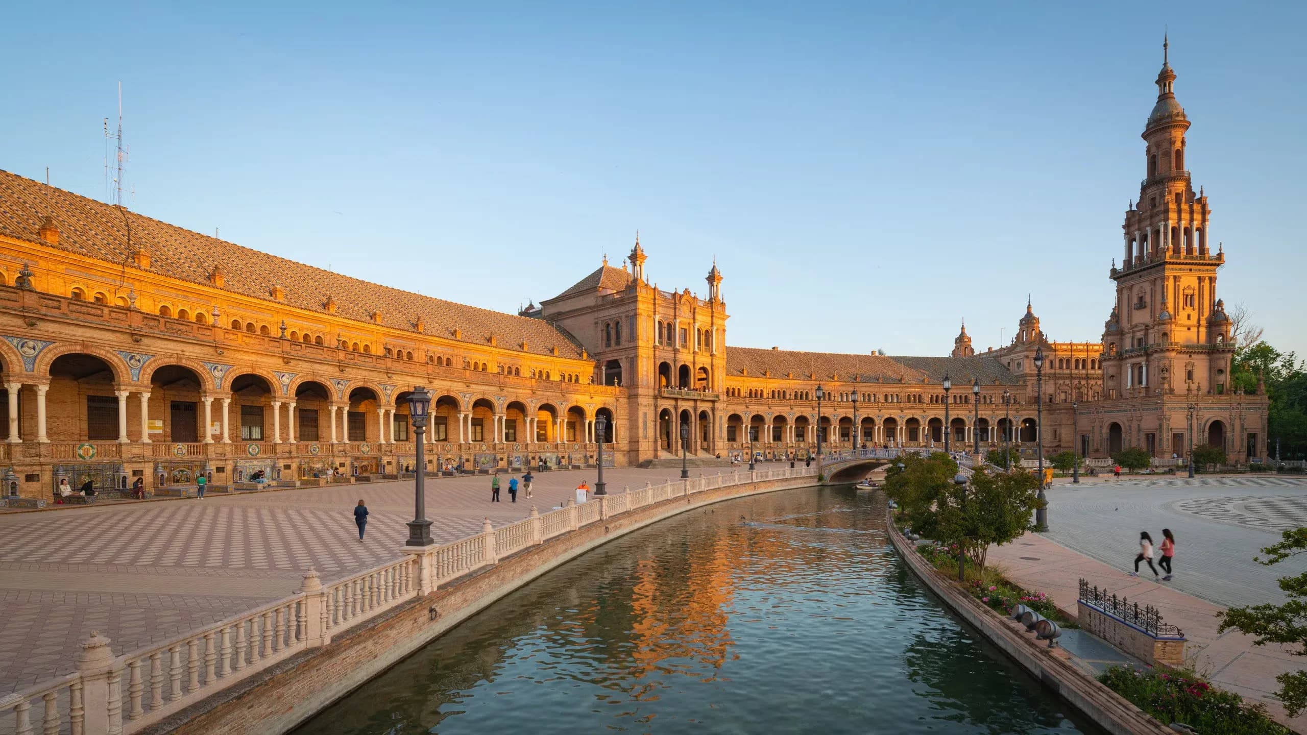 Historic Plaza de España in Seville, Spain, a grand outdoor event space with a canal.