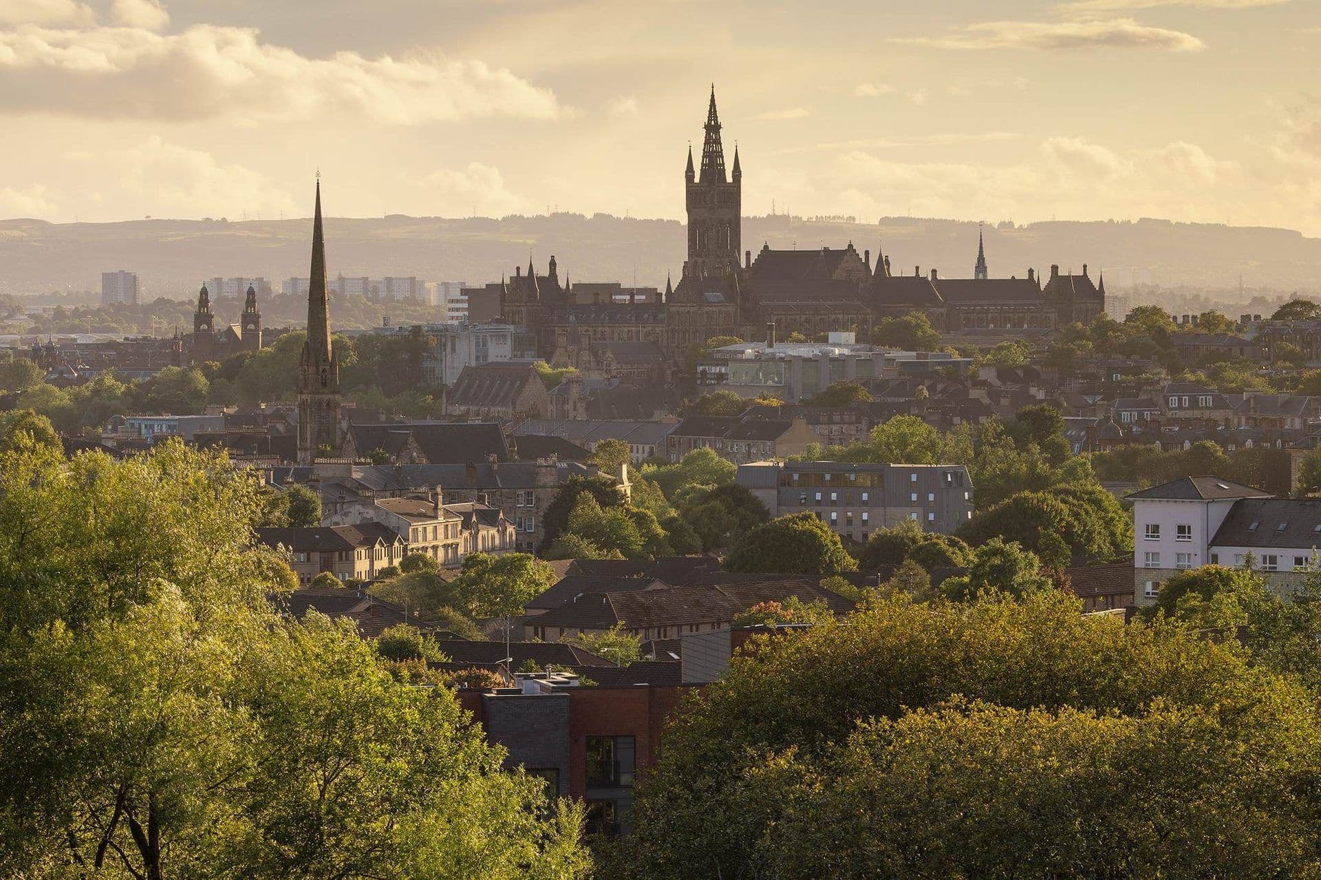 Glasgow city skyline featuring historic university buildings, a church spire