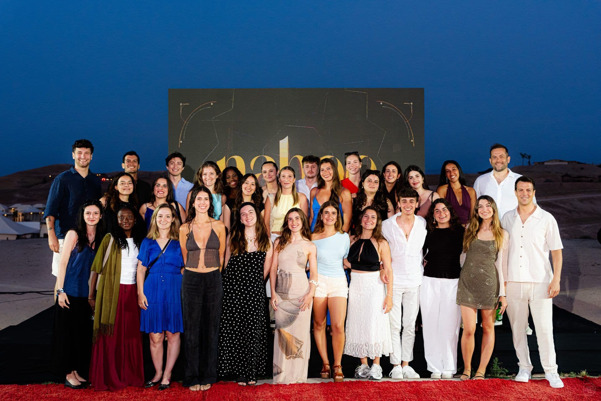 The Naboo team together on stage for the group photo at the 2026 company offsite