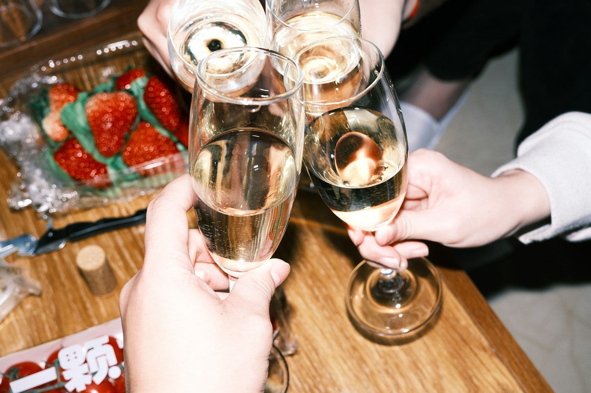 Colleagues toasting with wine glasses at a New Year's Eve gala