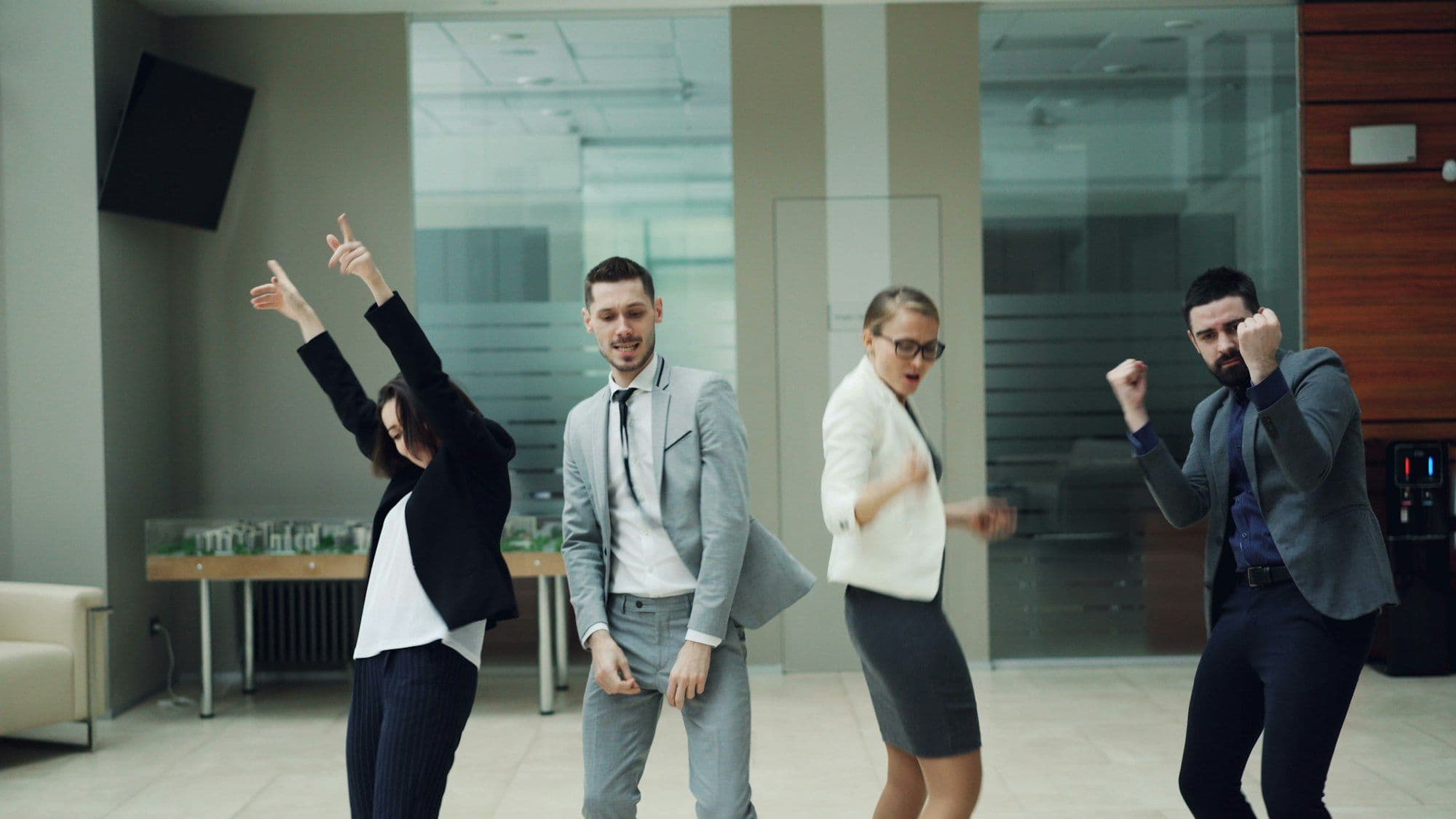 Coworkers dancing and celebrating at an office New Year's Eve party