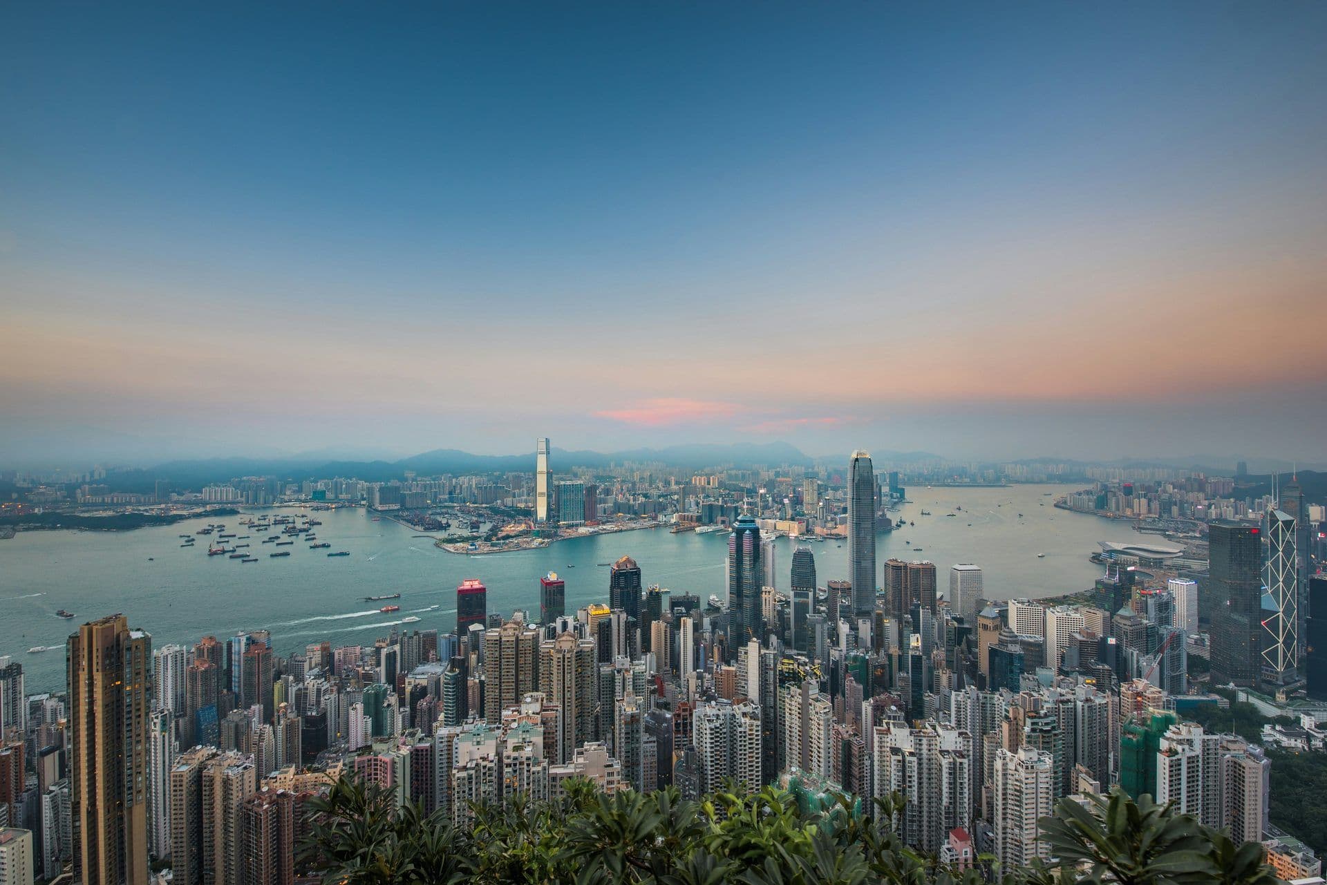 Hong Kong's vibrant skyline and Victoria Harbour at dusk, an ideal backdrop for corporate events.